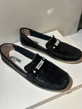Moschino Teen Black Patent Leather Slip-On Loafers with metal white Logo Accent